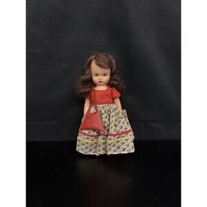 Vintage Nancy Ann Storybook doll includes a fabric dress and a small purse